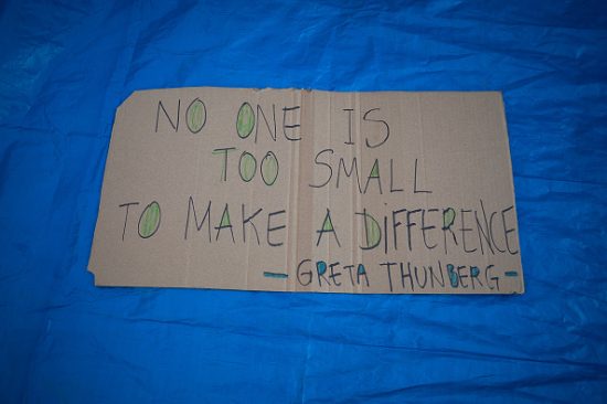 A placard with a phrase of environmental activist Greta